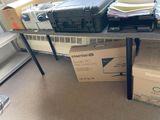 a table with a bunch of boxes on top of it