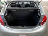 the back of a car with its trunk open in a parking lot