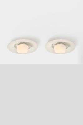 a pair of recess recessed downlights in a white finish