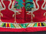 a red scarf with a picture of two flamingos on it