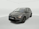 a grey citrole is parked in a white room