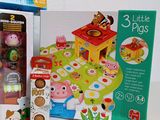 three little pigs toys in the box on the table