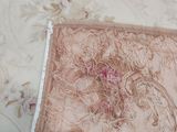 a piece of fabric that has been stitched together on a bed