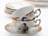 a cup and saucer with a picture of a woman on it