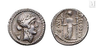 a silver coin with an image of a woman and a man on it