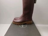 the boot is sitting on top of the box on the table