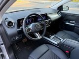 the interior of a car with a steering wheel, dashboard, and dashboard controls