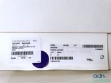 the back of a white box with a purple label on it