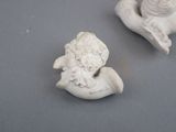 two figurines that are sitting on a table