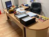 a desk with a laptop and a monitor on it