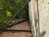 a metal pole sticking out of the side of a building