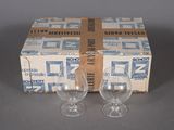 pair of empty wine glasses sitting in front of a box