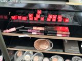 a display case full of cosmetics and makeup products