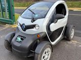 a small car that is parked in the parking lot