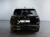the rear end of a black volkswagen suv parked in a white room