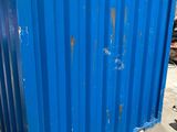a blue container sitting in the middle of a building