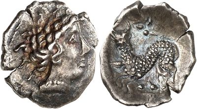 a silver coin with an image of a woman on it