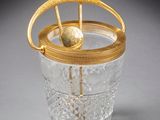 an image of a glass with a gold handle and a ball inside of it