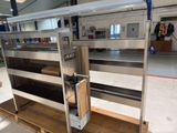 a metal shelf that has a bunch of shelves on it