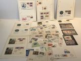 a lot of stamps and postcards on the table