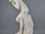 an image of a statue of a man with his head in his hands