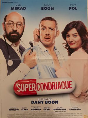l'affiche du film « Super Contriquee », mettant en scène deux hommes et une femme