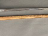 two swords that are on display on a table