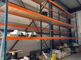 many shelves in the warehouse with various items on them