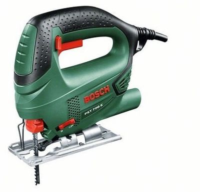 a green and black electric jig saw sitting on top of a table