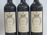 three bottles of wine sitting next to each other on a table