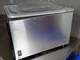 a microwave sitting on top of a table in a kitchen