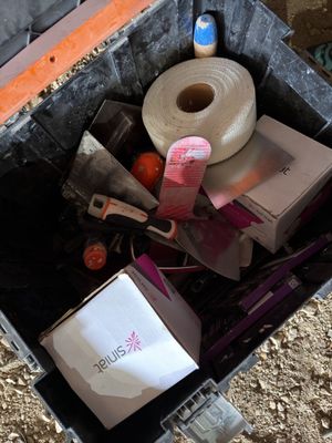 a box full of items that are sitting on the ground