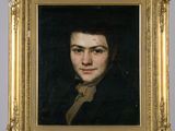 portrait d'un jeune homme en manteau noir, dans un cadre doré