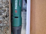 a box with a cordless drill in it on the ground