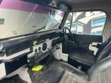 a black and white car with two seats and a steering wheel