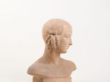 marble bust of a woman with braids on a white background