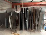 a lot of different types of metal sheets in a warehouse