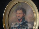 portrait of a man in a military uniform in a gold frame