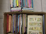 a box full of books sitting on the floor