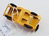 a yellow toy truck with a tag attached to it