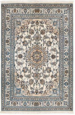 a white and blue rug with a floral design on it