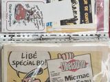 a lot of newspapers and magazines on the table