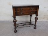 a small wooden table with a drawer on top of it