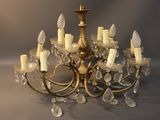 a chandelier made of glass and gold colored metal