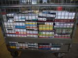 a cart full of cigarettes sitting in a warehouse
