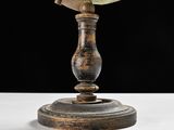 a small globe on a stand on a table