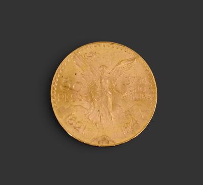 une pièce d'or sur laquelle est représenté un ange