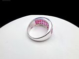 a close up of a ring on a white surface