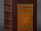 a brown book with a red design on it
