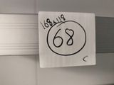 a sticker with the number 63 on it hanging on a wall